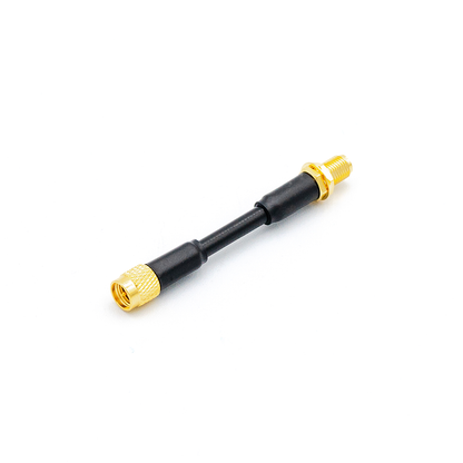 Straight view of SMA extension lead with gold connectors and short black coax cable