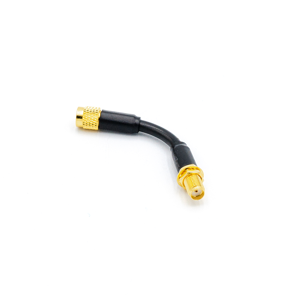 5cm flexible SMA extension cable with gold connectors, angled view showing bent coax lead