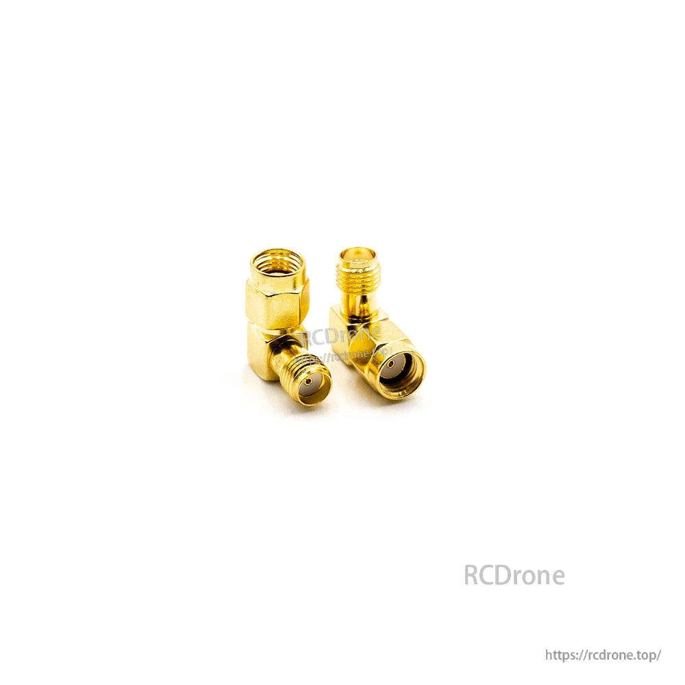Gold elbow coax adapters on white background, side-by-side view showing both connector ends
