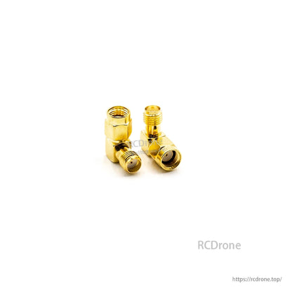 Gold elbow coax adapters on white background, side-by-side view showing both connector ends