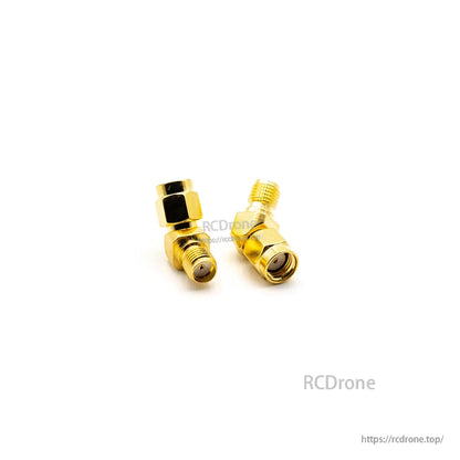 Right-angle SMA/RP-SMA adapter close-up showing elbow joint and threaded connector openings