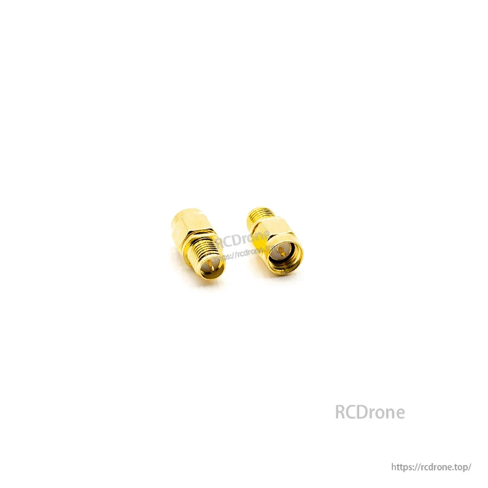 Straight coax adapter pair on white background, gold finish with threaded SMA-style ends