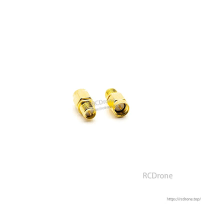 Straight coax adapter pair on white background, gold finish with threaded SMA-style ends