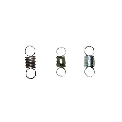 Three Futaba T10PX steering wheel spring coils in different sizes/finishes on white background