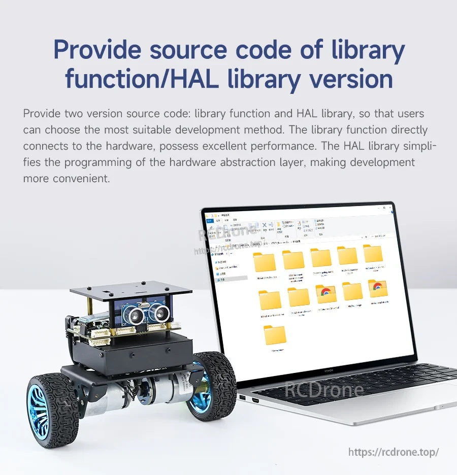 Yahboom STM32 self-balancing two-wheel robot with ultrasonic sensor module beside a laptop showing source code folders