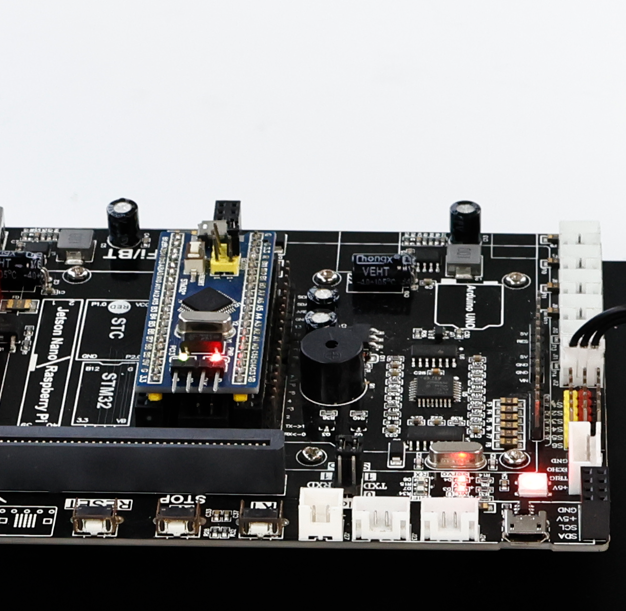 STM32 core board for DOFBOT-SE replacement control board mounted on controller PCB, close-up with status LEDs