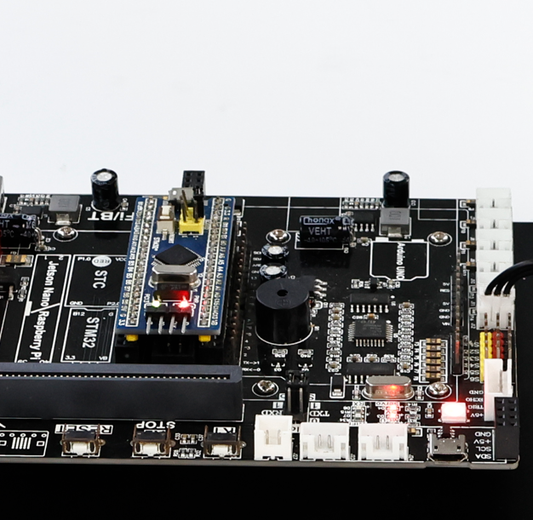 STM32 core board for DOFBOT-SE replacement control board mounted on controller PCB, close-up with status LEDs