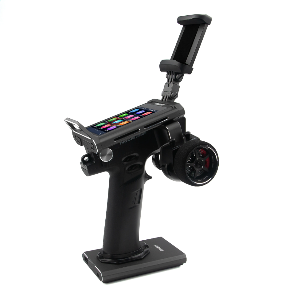 FlySky Noble NB4 Pro+ pistol-grip RC transmitter on stand with color touchscreen and phone holder