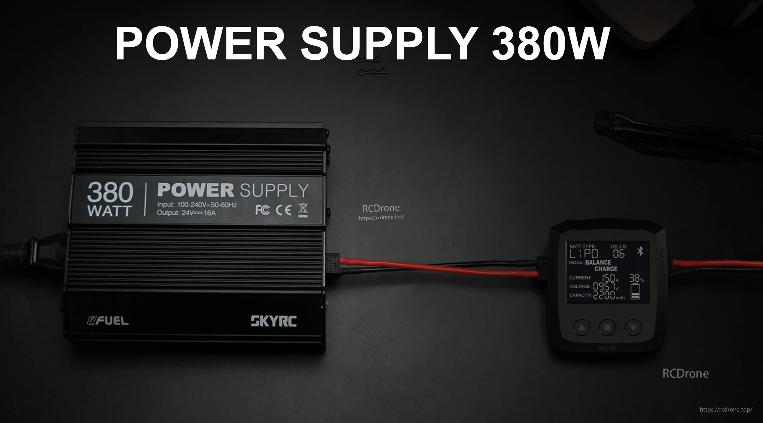 SkyRC 380W 24V DC Power Supply connected to an RC charger, delivering regulated 24V output up to 16A