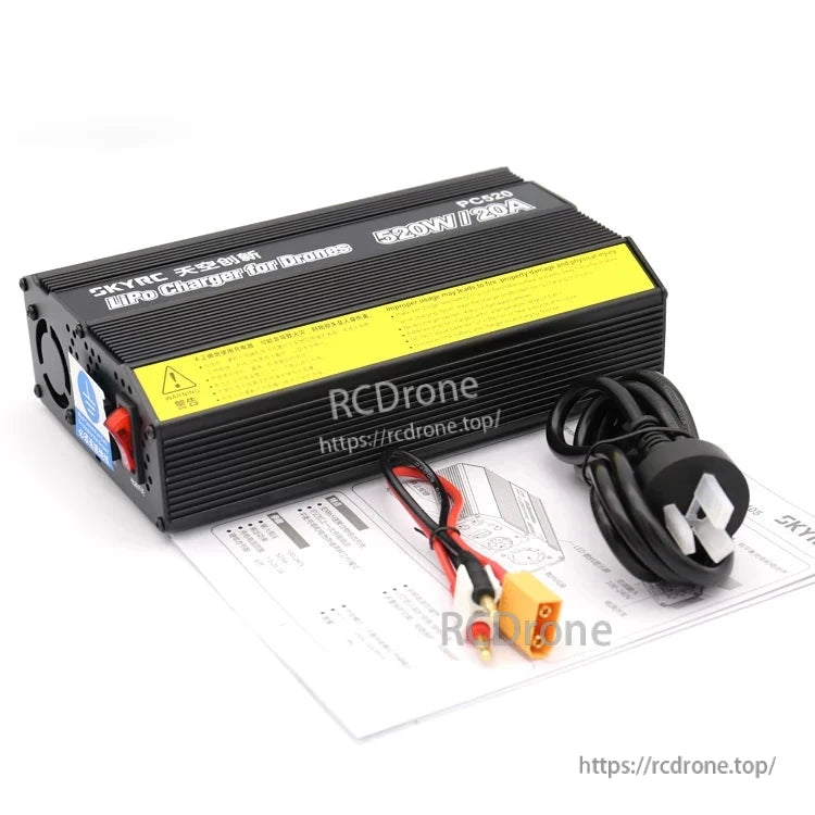 SkyRC PC520 balance charger unit with built-in cooling fan, UK mains plug lead, and output cables
