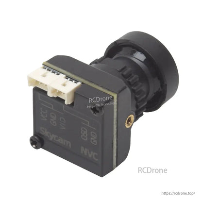 Angled rear view showing dual plug connectors on top and side brass mounting insert on camera body