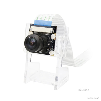 Camera module with wide-angle lens mounted on clear acrylic stand, ribbon cable connected at top