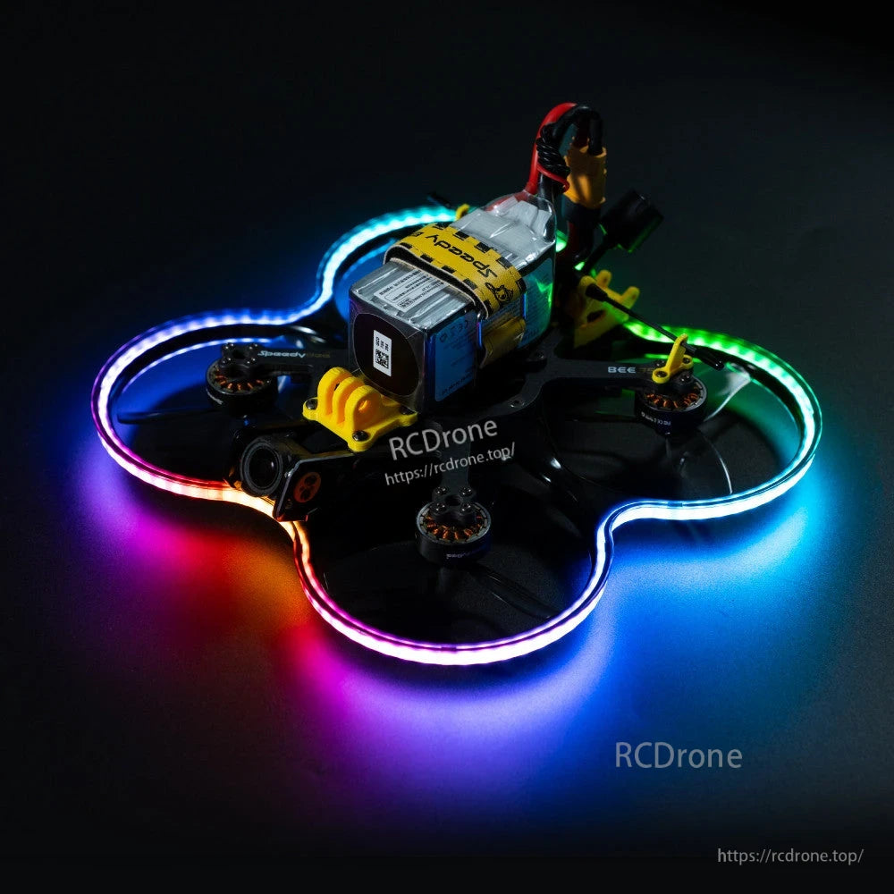 SpeedyBee Bee35 Meteor LED V2 strip installed on FPV cinewhoop frame, creating a multicolor glow around the prop guards