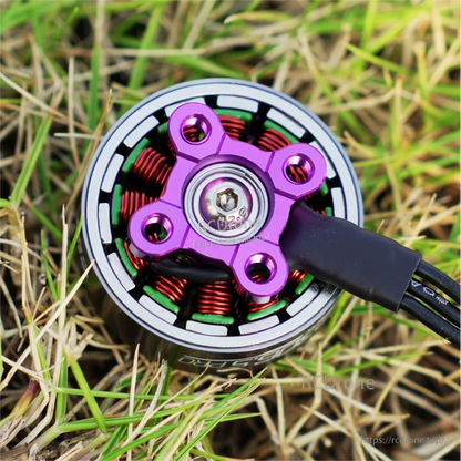 Top view of SpeedyBee BeeStorm FPV drone brushless motor with purple hub, copper windings and attached wires