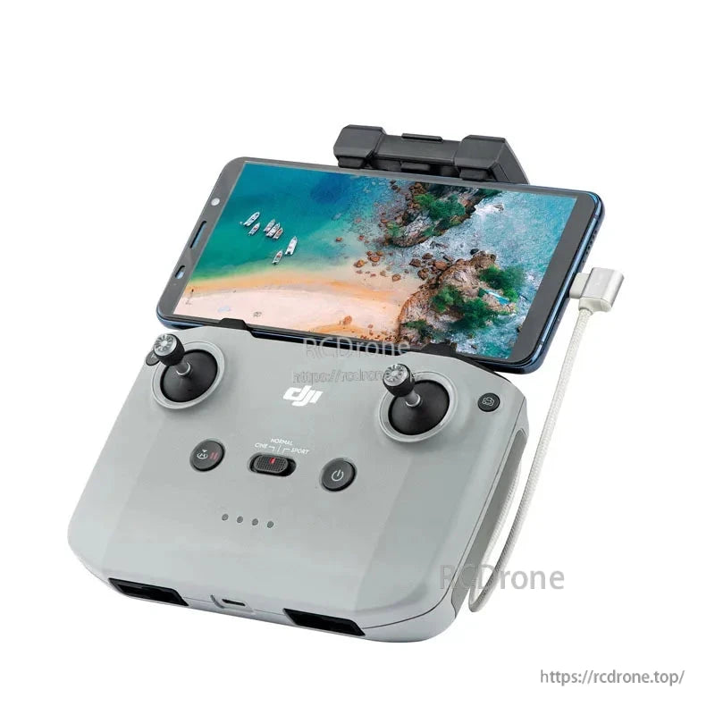 StartRC Data Cable, DJI remote control with smartphone mount, dual joysticks, power button, and data cable for seamless drone operation.