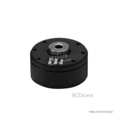 Low-angle close-up of motor front face with center hub and perimeter screw holes