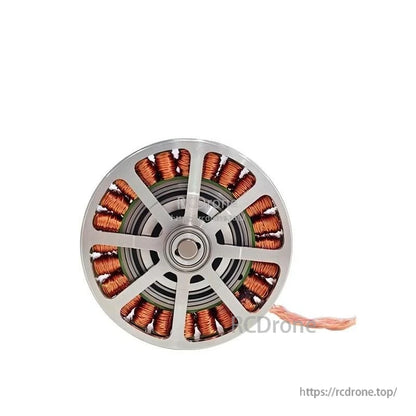 Front view of motor with silver spoke cover over copper windings and center bearing opening