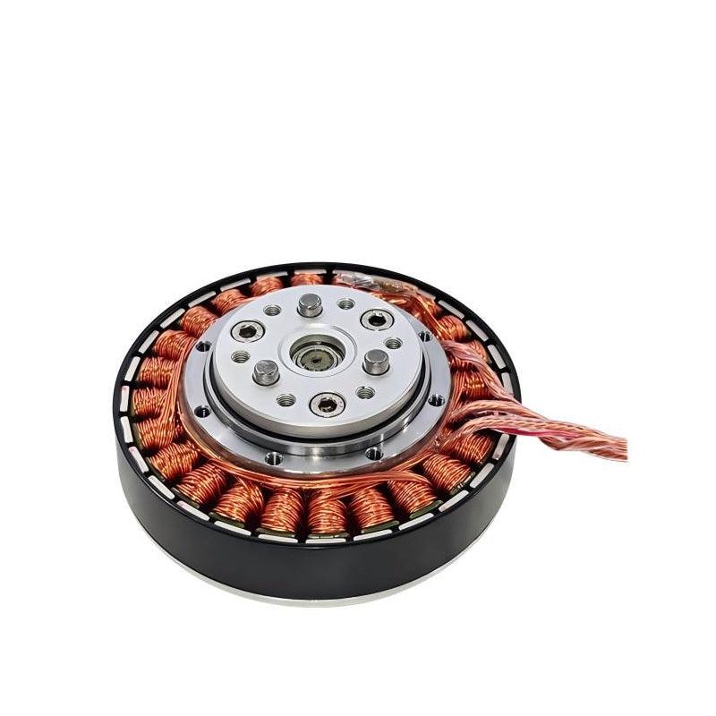 Angled view of motor stator windings with raised hub plate, bolt holes, and braided wire leads