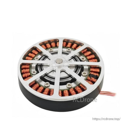 Low-angle view of motor face with spoke cover, fasteners, and copper coil arrangement