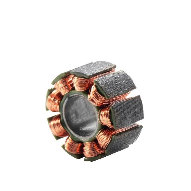 Motor stator core with copper windings and segmented iron poles, angled view