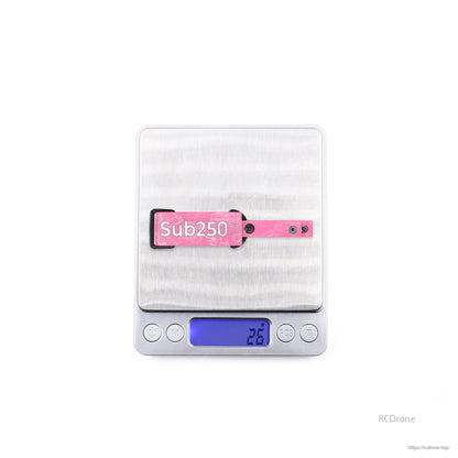 Pink Sub250 goggle strap on digital scale showing displayed weight 23.6 g
