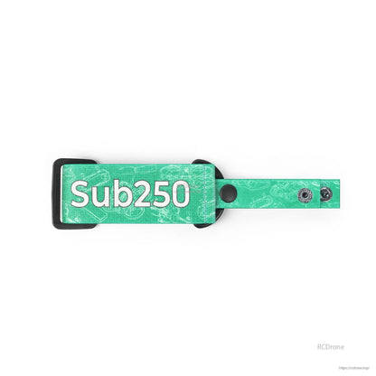 Green strap close-up showing Sub250 logo patch, nylon weave pattern, and dual snap fasteners