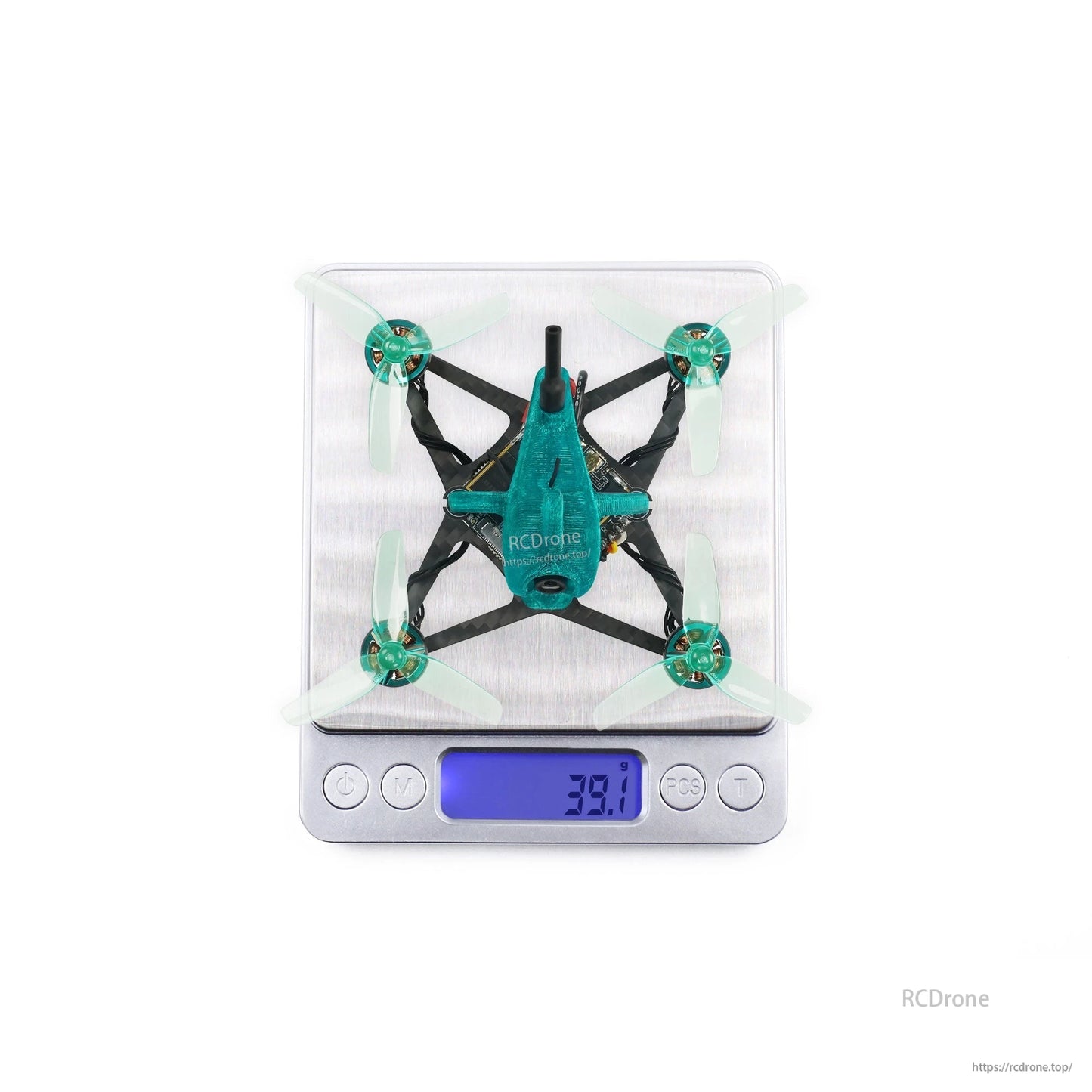 Micro drone shown on digital scale with 39.1 g reading, top view for weight reference