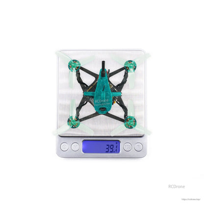 Micro drone shown on digital scale with 39.1 g reading, top view for weight reference