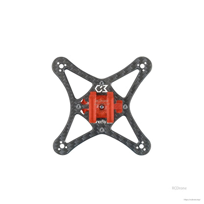 Top view of carbon plate with red battery holder mount installed at center