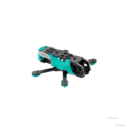 Front three-quarter view of FPV frame showing camera cage, top plate cutouts, and carbon arms