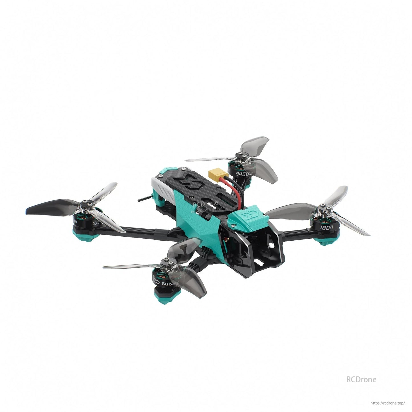 Front-right angle highlighting camera cage, teal canopy, and rear electronics stack cover