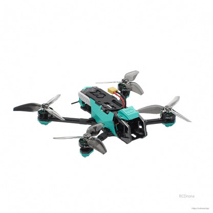 Front-right angle highlighting camera cage, teal canopy, and rear electronics stack cover