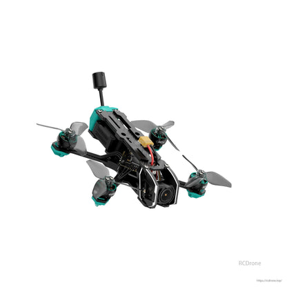 Front-right perspective of the quad showing camera cage, carbon frame arms, and rear-mounted antenna