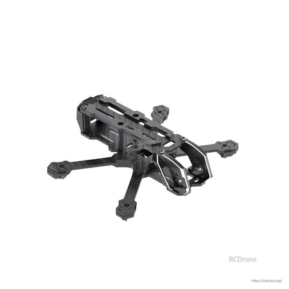 Angled front view of FPV drone frame showing top plate cutouts and protective camera cage