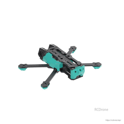 Rear angled view of the drone frame showing tail block, carbon fiber arms, and top plate mounting slots
