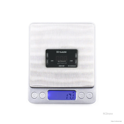 Charger on digital scale showing weight reading of 17.9 g