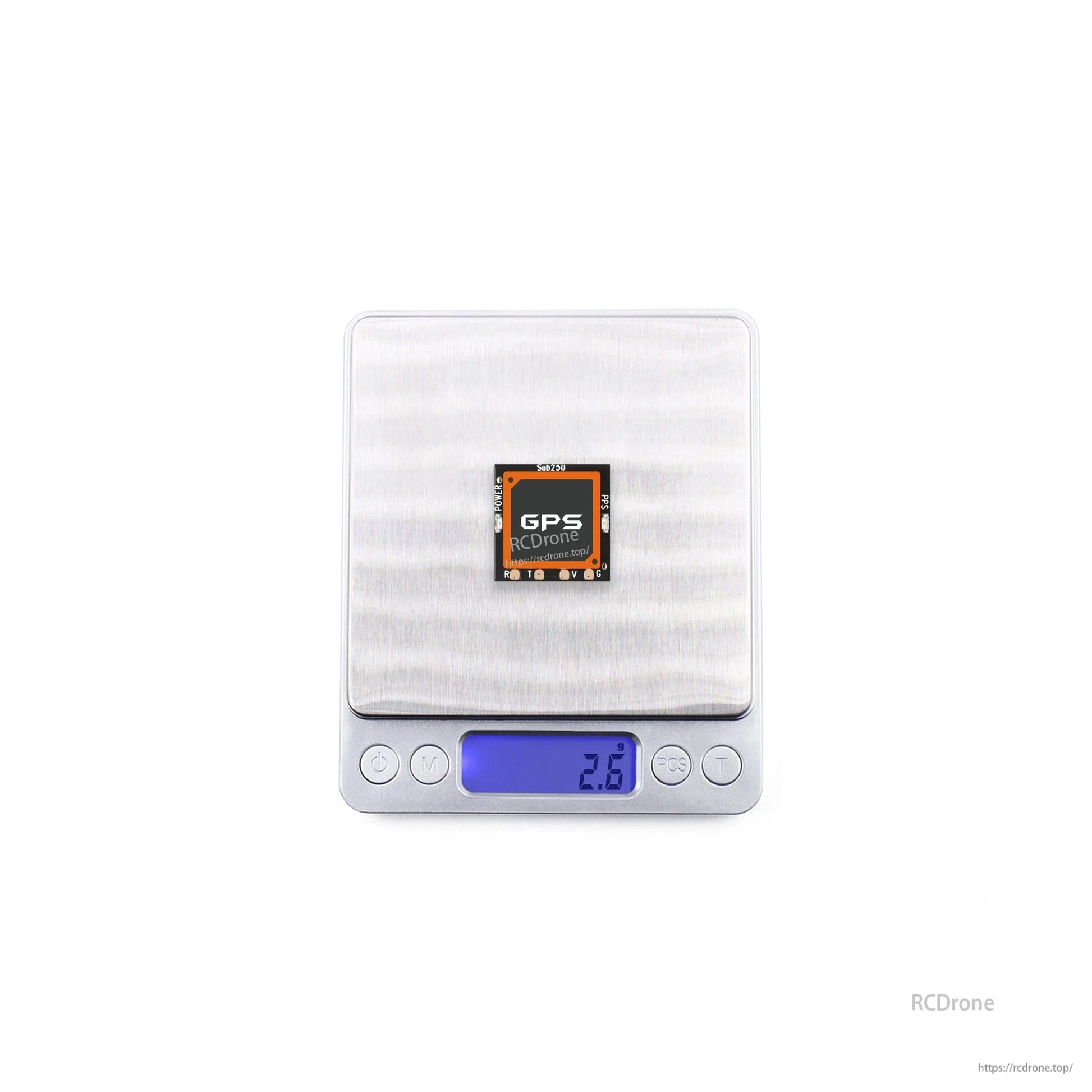 GPS module on digital scale showing 2.8 g weight reading