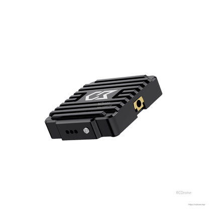Angled side view highlighting the gold antenna connector and vent holes on the transmitter case