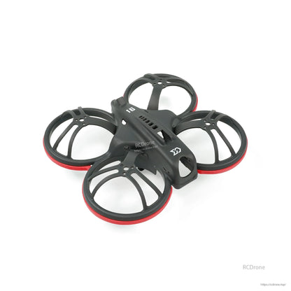 Angled top view of whoop frame with red bumper rings and vented center spine