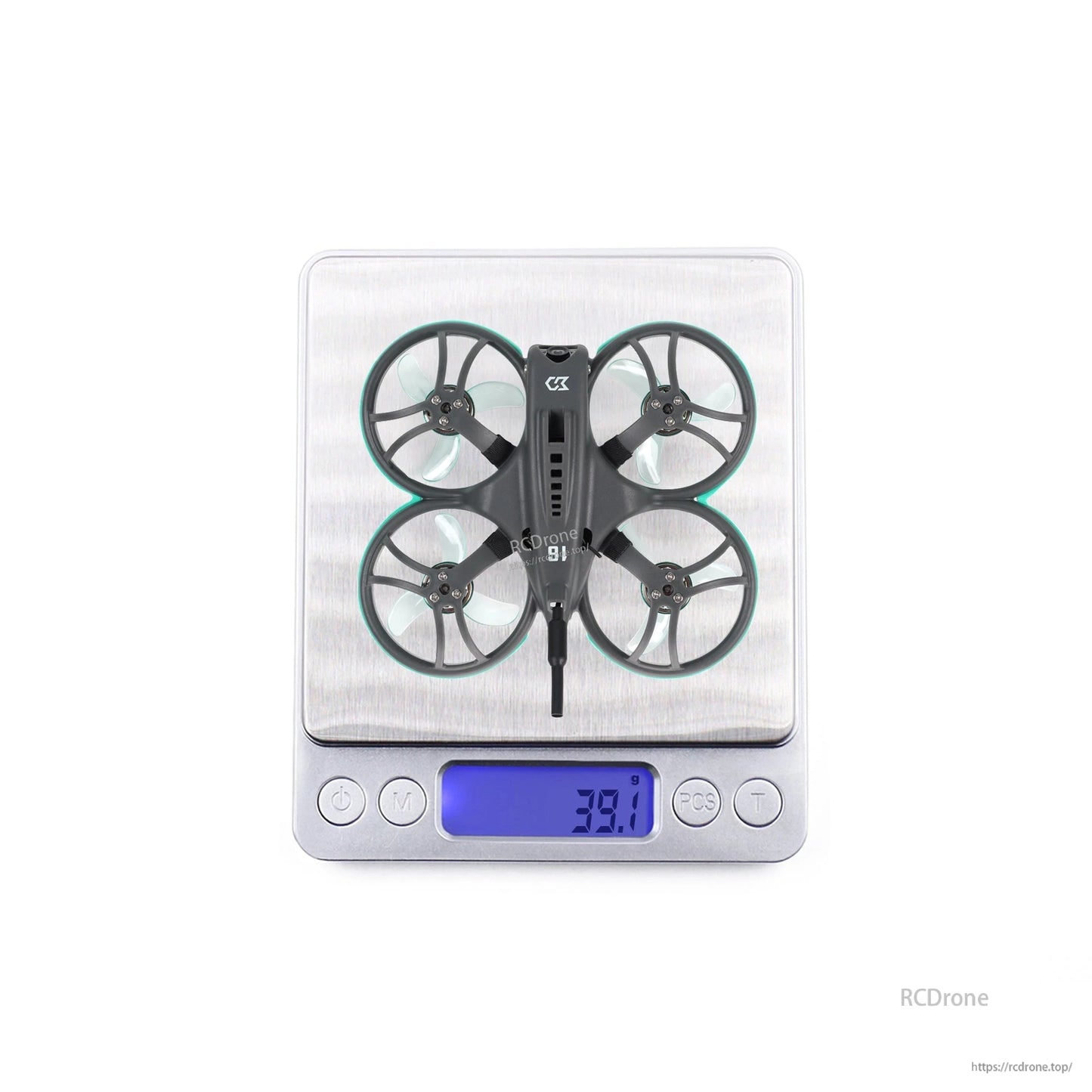 Whoop drone on digital scale showing 39.1 g weight reading