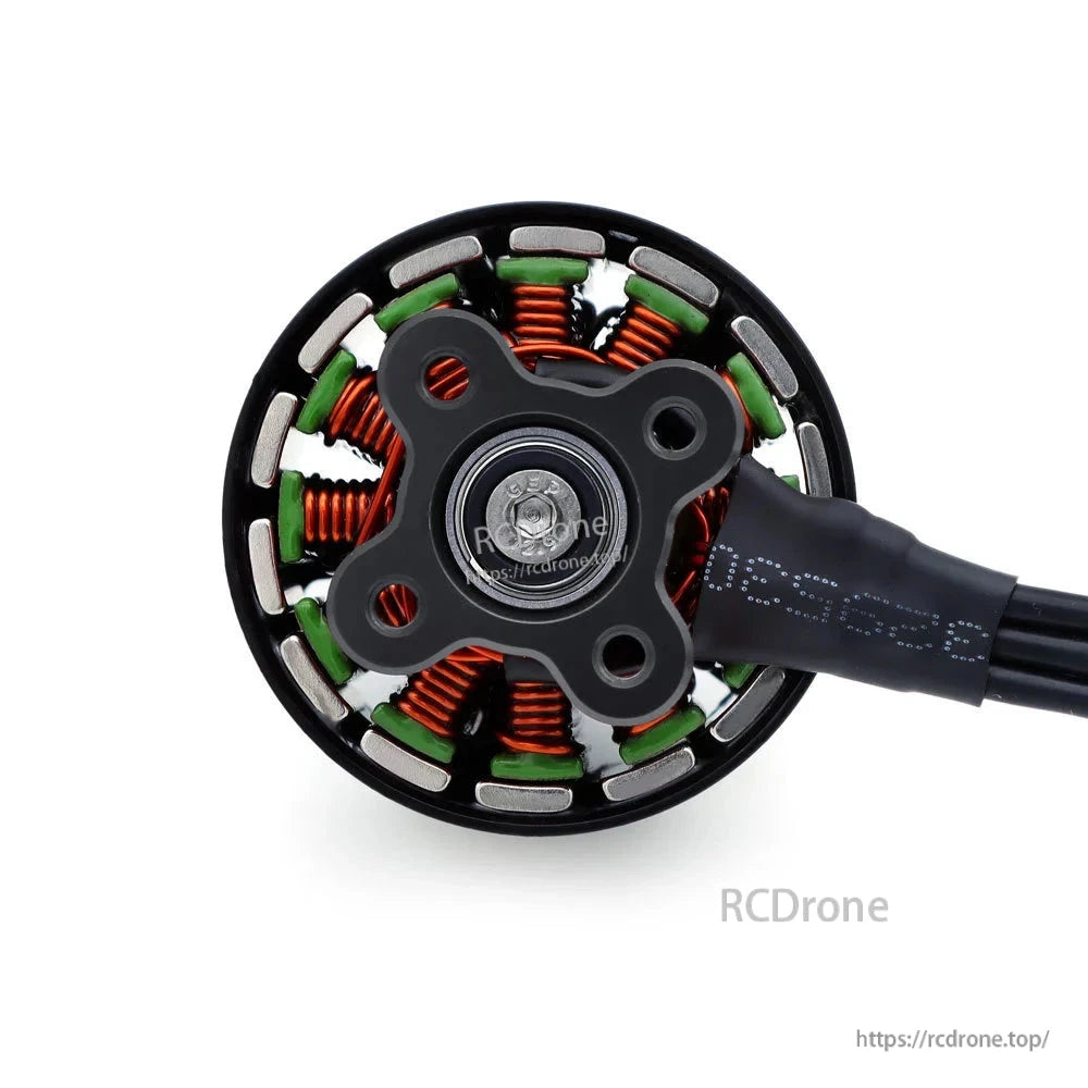Rear view of B3115 brushless motor stator, copper windings, mounting holes, and wire lead