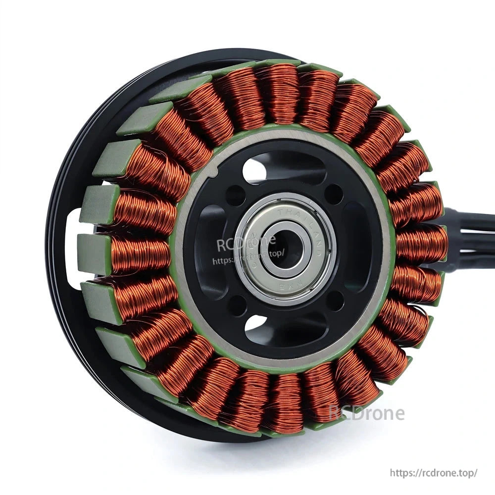 Brushless motor stator close-up showing copper windings, magnets, and center bearing