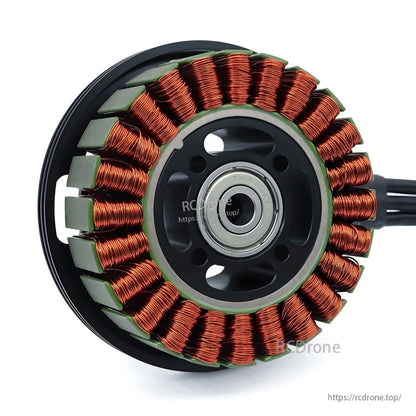 Brushless motor stator close-up showing copper windings, magnets, and center bearing