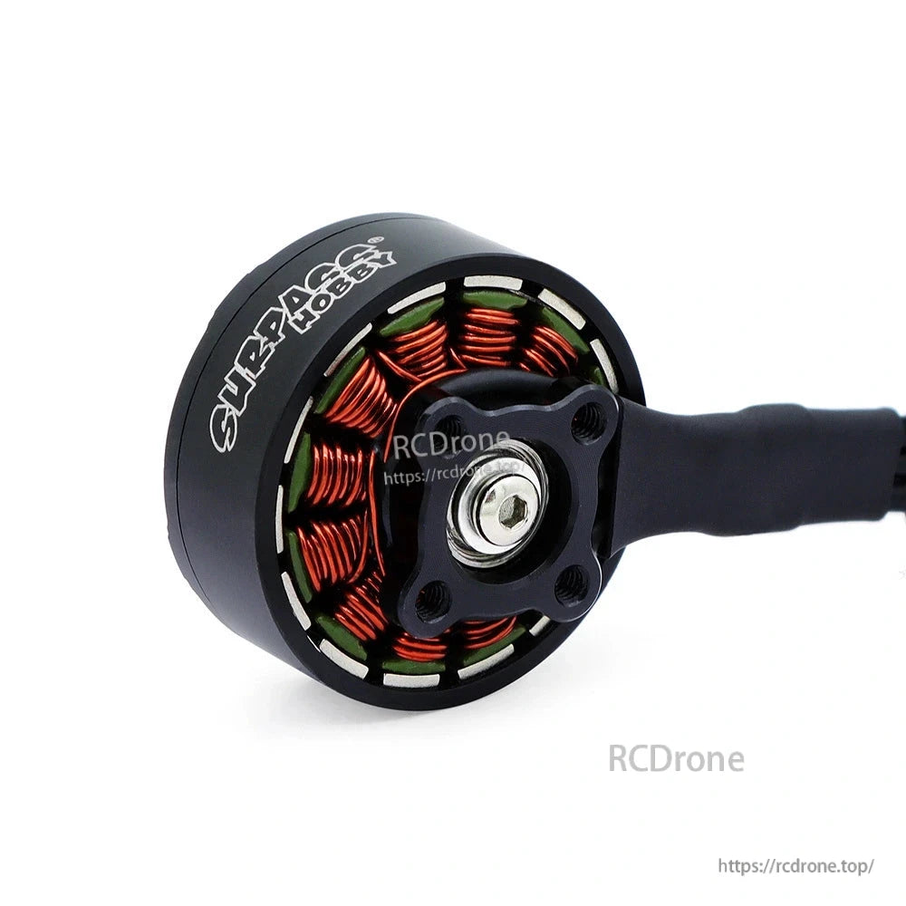 Brushless motor underside showing copper windings, rotor hub, and four mounting holes