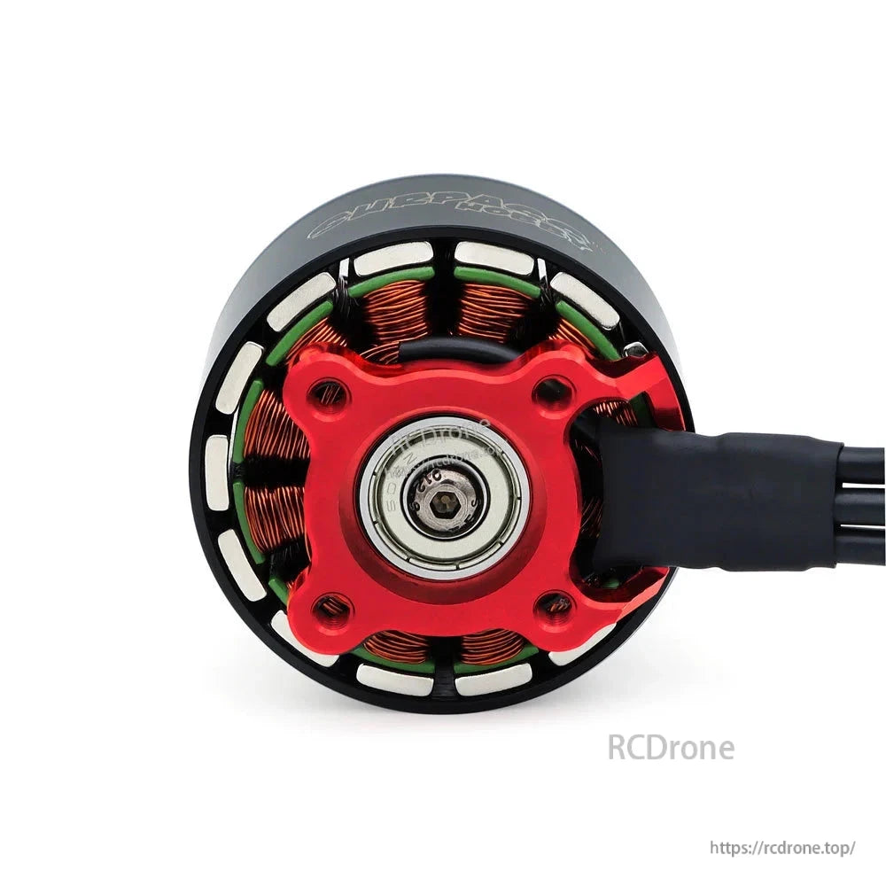 Bottom view showing red mounting base, central bearing, and exposed stator windings on S4218 motor