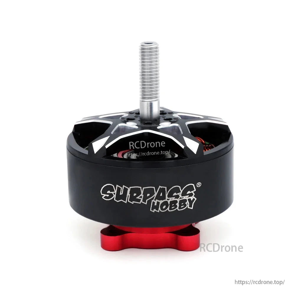 Front view with Surpass Hobby logo, threaded shaft, and red mounting base on black motor can
