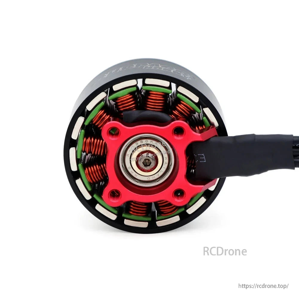 Bottom view of BAT S4720 motor showing center bearing, red mounting base and copper windings
