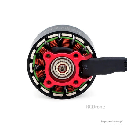 Bottom view of BAT S4720 motor showing center bearing, red mounting base and copper windings