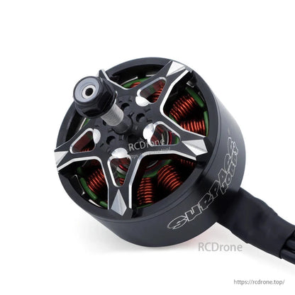 Top angle close-up of BAT S4720 motor bell with star-shaped rotor cap and threaded shaft with nut