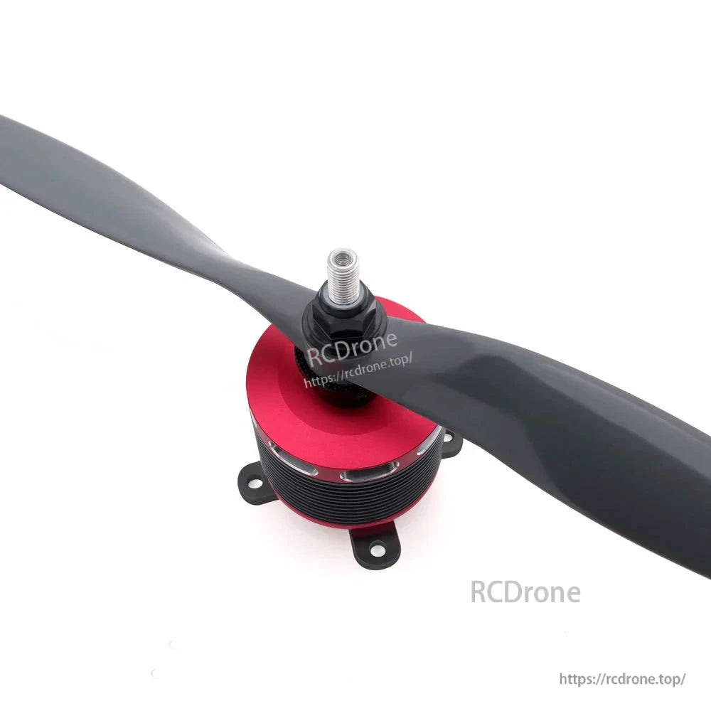Brushless motor installed with propeller attached, showing top mount and threaded shaft